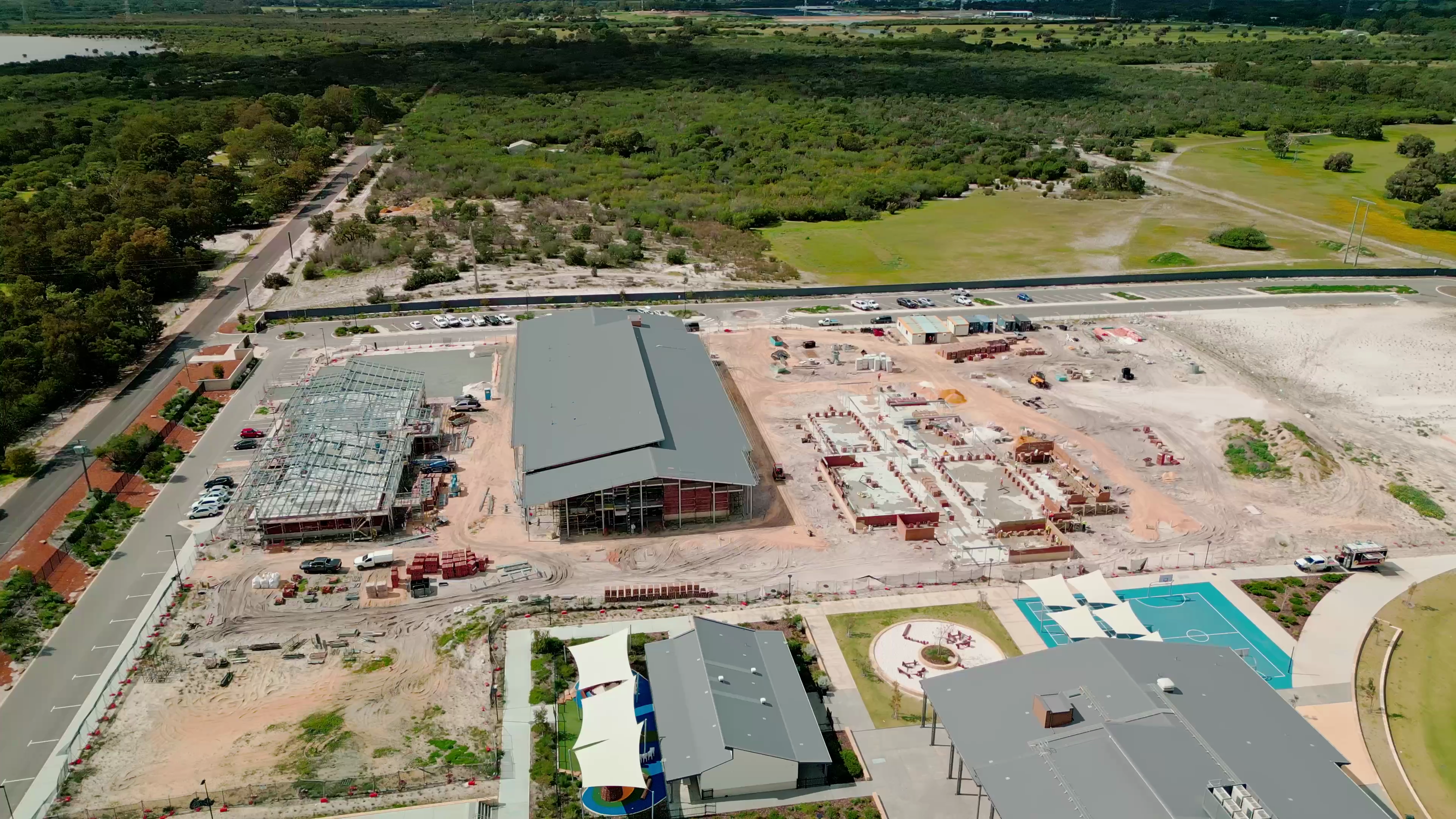 Last month saw major milestones across the site, with the roof installed on the new double-storey high school, structural steel erected for level 1 of the administration building, and brickwork advancing quickly on the ground floor of the specialty building.
