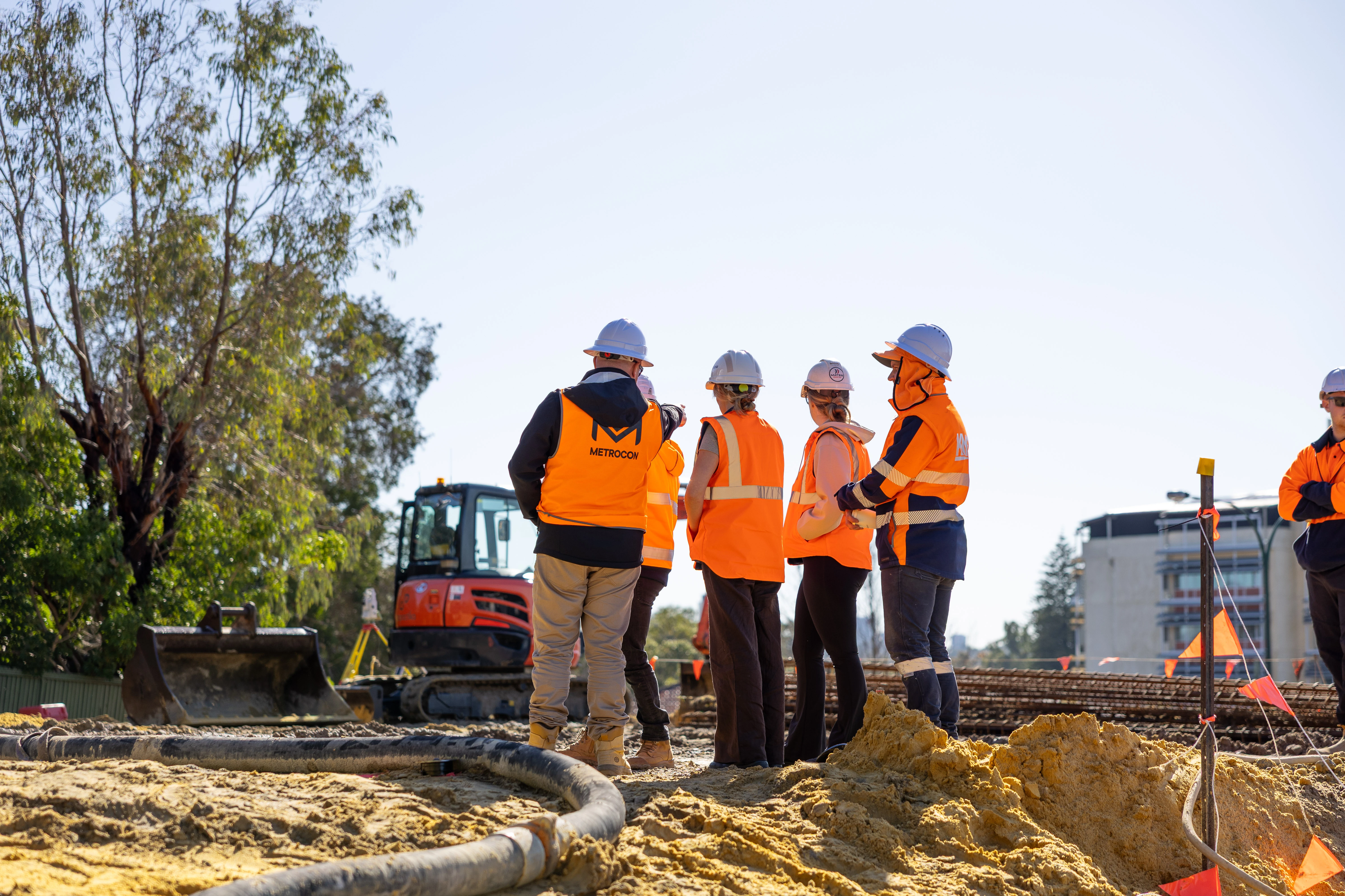 Metrocon staff surveying a project