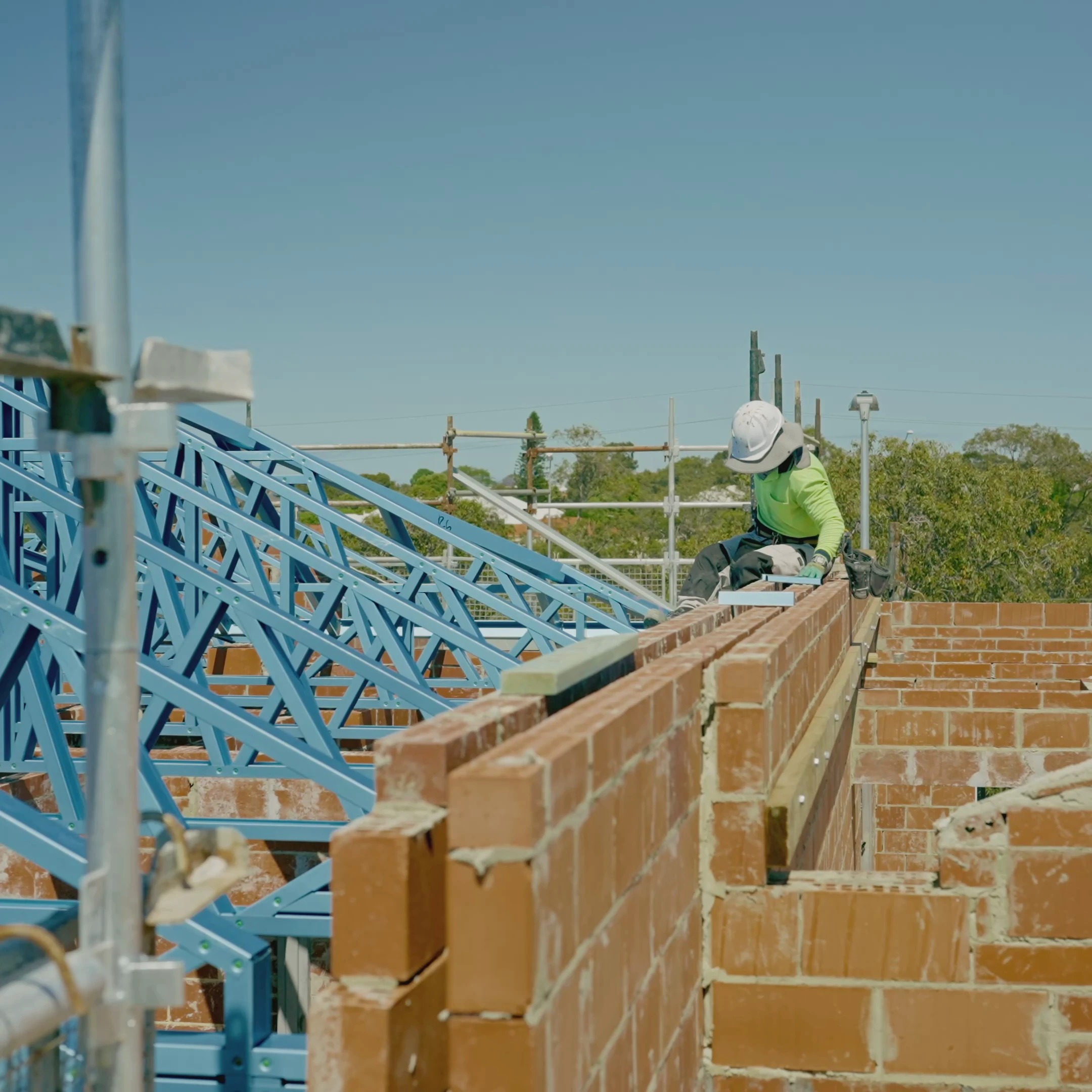 From first-floor brickwork to roof trusses, the team has been busy hitting milestones across this new two-storey townhouse development in Stirling.